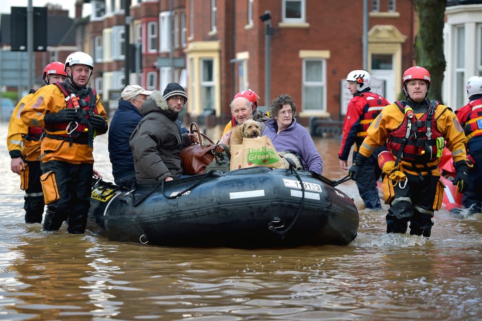 CARLISLE, ENGLAND - DECEMBER 07: Rescue teams continue to to evacuate people from their homes after Storm Desmond caused flooding on December 7, 2015 in Carlisle, England. Storm Desmond has brought severe disruption to areas of northern England with dozens of flood warnings remaining in place.England. (Photo by Jeff J Mitchell/Getty Images) *** BESTPIX ***