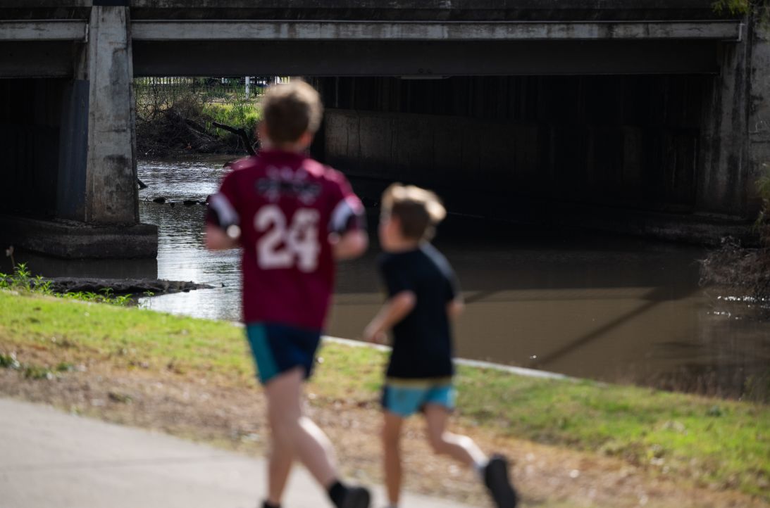 Local residents run and walk along Myall Creek in Dalby, Australia, on October 10, 2026.