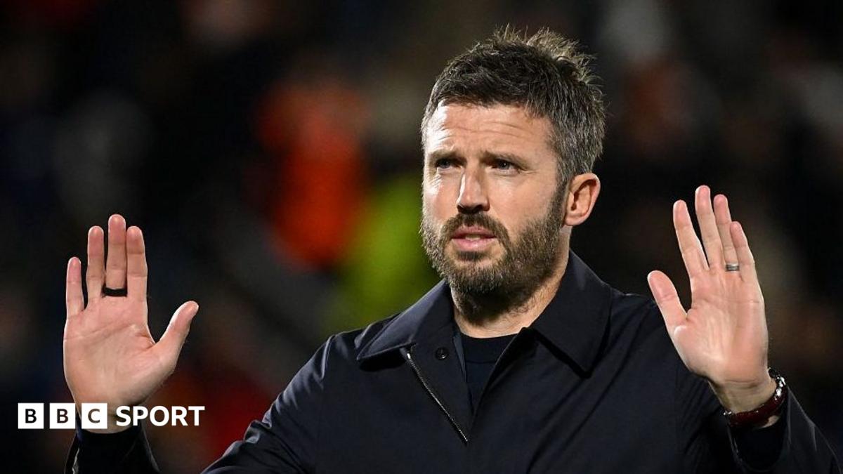 Manchester United manager Michael Carrick holds up his hands