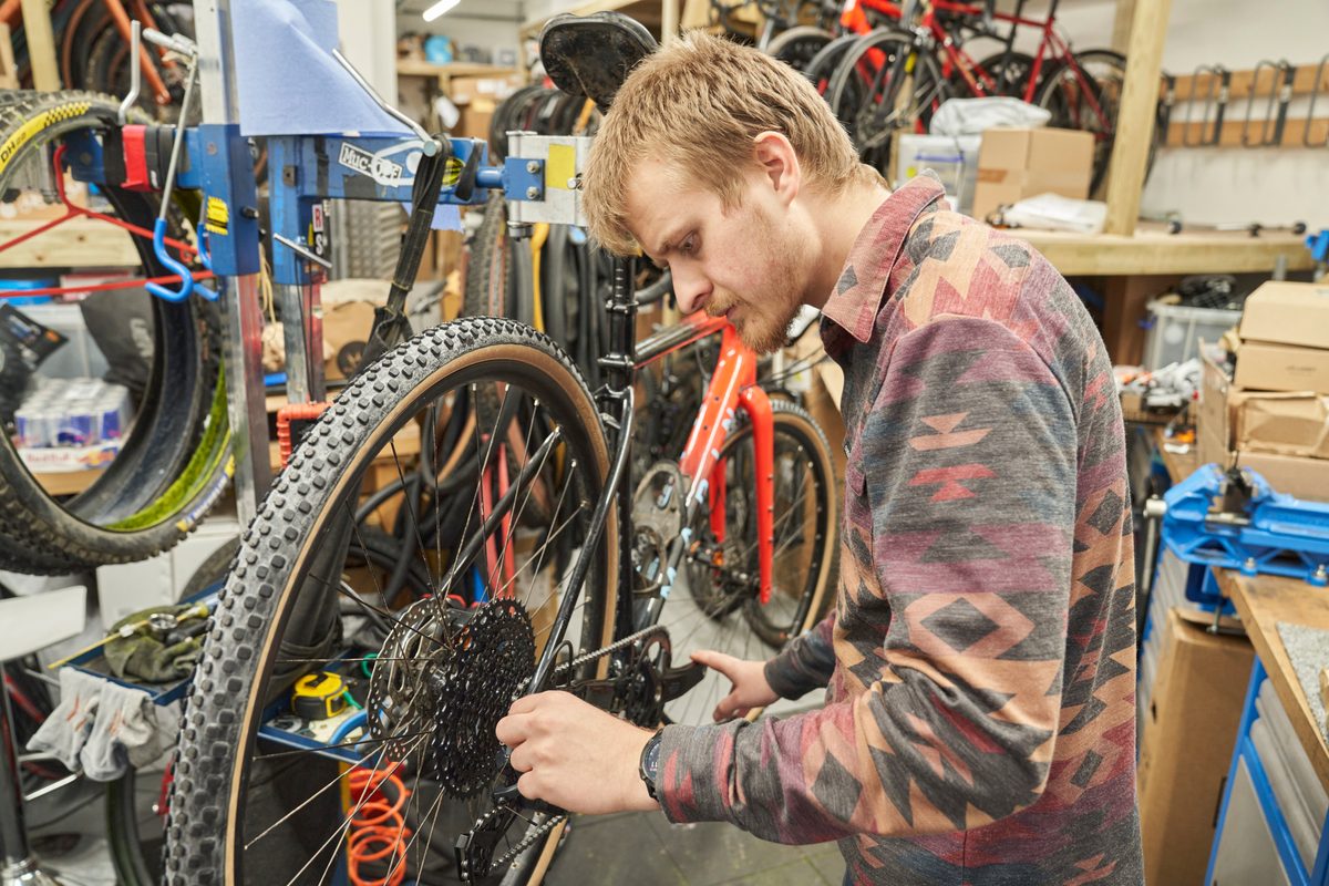 Oscar Huckle adjusting gears on Microsoft Sword in the workshop