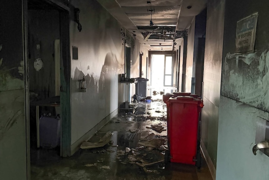 Corridor of building damaged by fire.