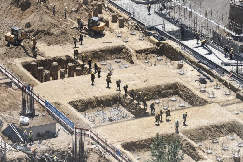 Workers at a construction site in Hohhot, Inner Mongolia in June.