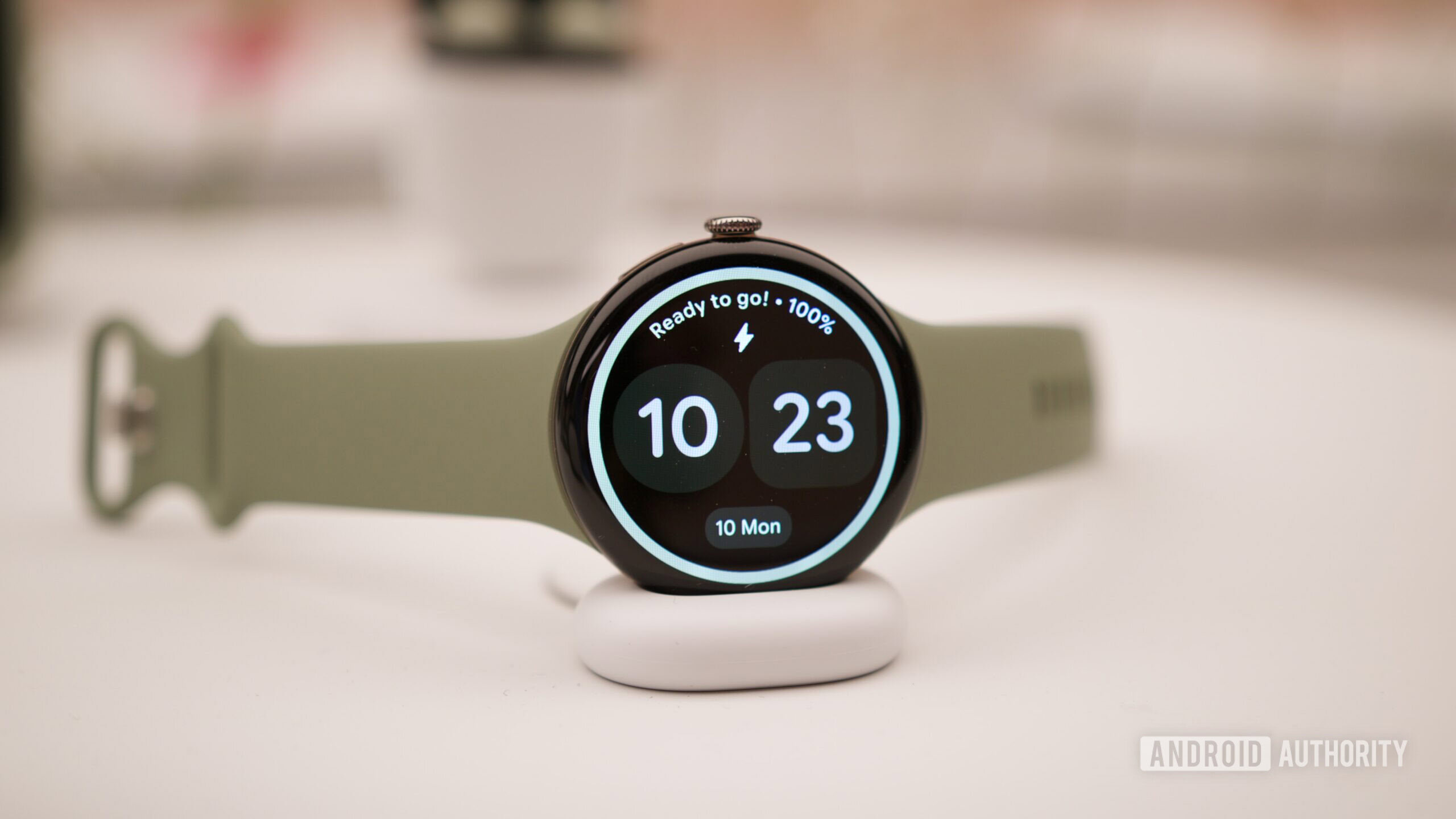 Google Pixel Watch 5 on its charging dock.