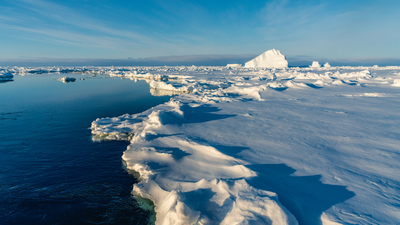 Arctic ice had been expanding for at least 1,000 years before reaching its greatest extent around 1960; researchers say greenhouse warming then reversed a natural slide toward another ice age