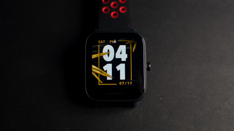 An Amazfit smartwatch against a shadowy background