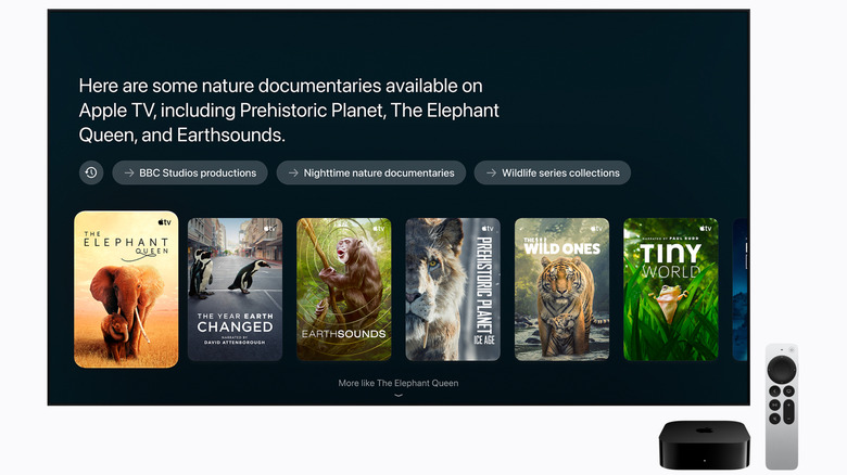 An Apple TV 4K with remote and Siri suggestions showing on a TV.