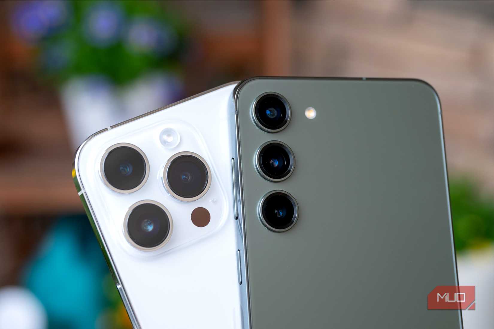 Rear cameras showing Android Samsung Galaxy S23+ and Apple iPhone 14 Pro