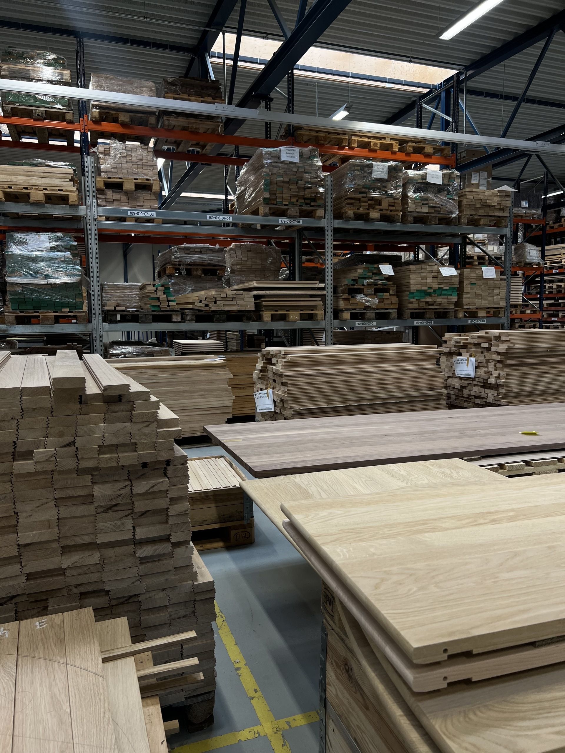 Image of lots of stacks of wood in a factory