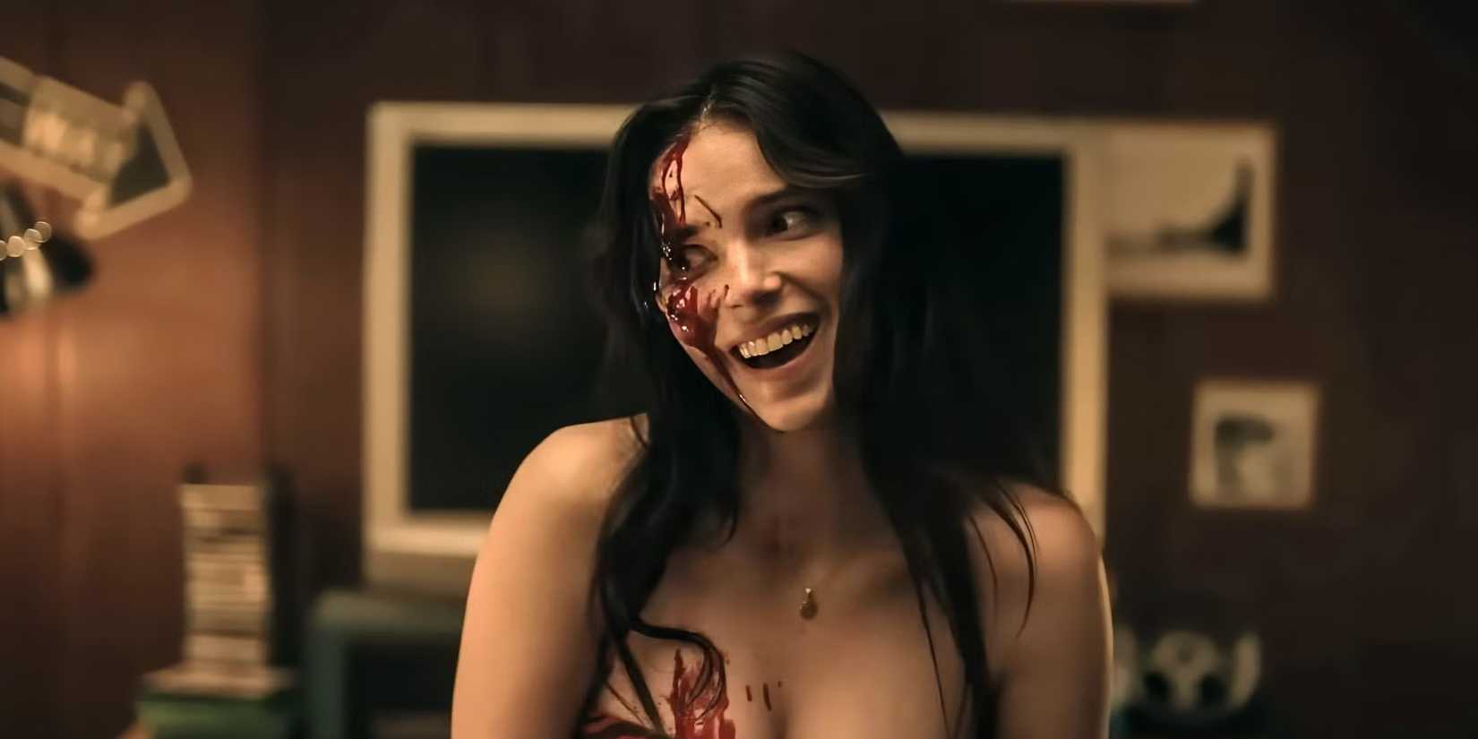 Nikki smiles while covered in blood in Obsession