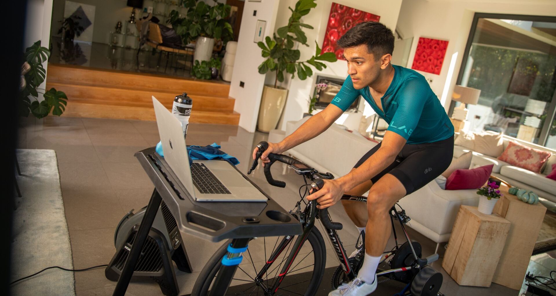 Male cyclist completing an indoor cycling workout