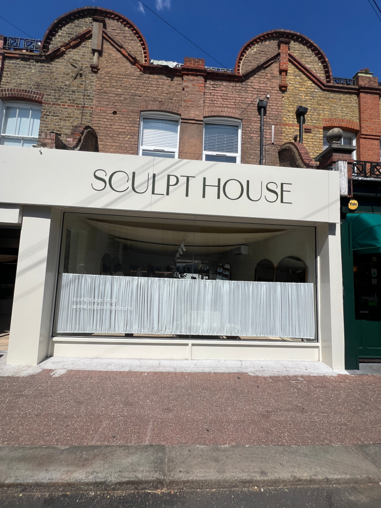 Sculpt House shopfront on Lacy Road, its name above a wide window curtained across the lower half