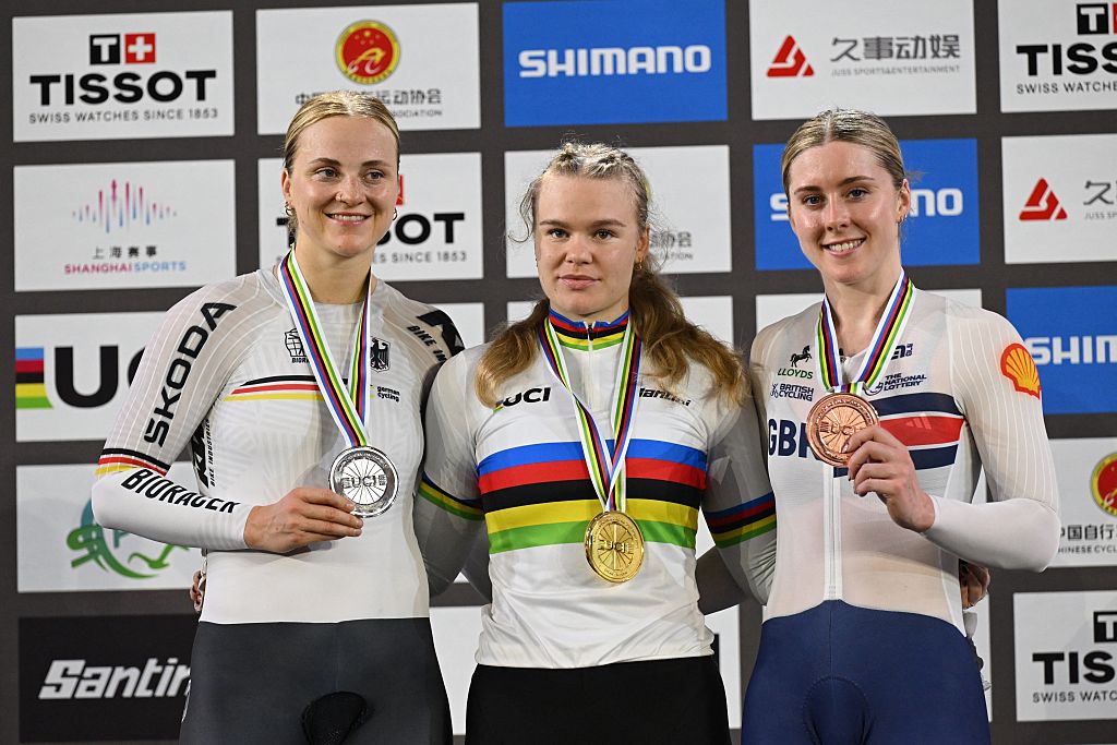 (L-R) Silver medalist Germany&rsquo;s Lea Sophie Friedrich, gold medalist Russia&rsquo;s Alina Lysenko and bronze medalist Britain&rsquo;s Emma Finucane pose for photos in the award ceremony for the women&rsquo;s keirin final at the 2026 UCI Track World Championships at the Shanghai Velodrome in Shanghai on October 18, 2026. (Photo by JADE GAO / AFP)