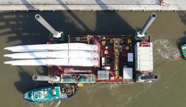 Seven 406-foot wind turbines stand bladeless six miles off the Irish coast after a jack-up barge climbed out of the sea on four legs and pulled 18 blades off them nine at a time, and their owner now wants the towers down too, warning the steel degrades faster every year it stands