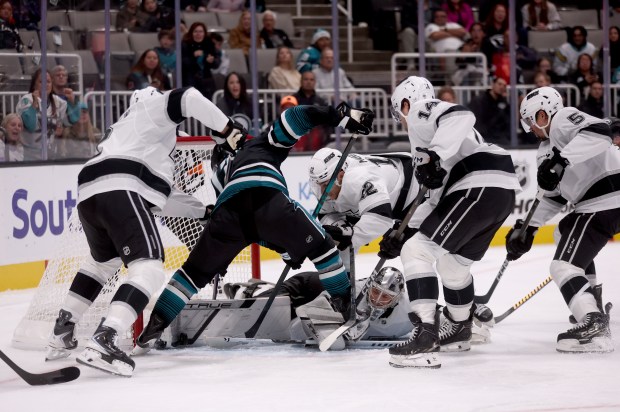 San Jose Sharks’ Michael Misa #77 tries to score a...