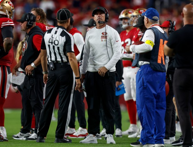 San Francisco 49ers head coach Kyle Shanahan  talks to a referee during their game against the Atlanta Falcons in the second quarter at Levi's Stadium in Santa Clara, Calif., on Sunday, Oct. 19, 2025. (Nhat V. Meyer/Bay Area News Group)