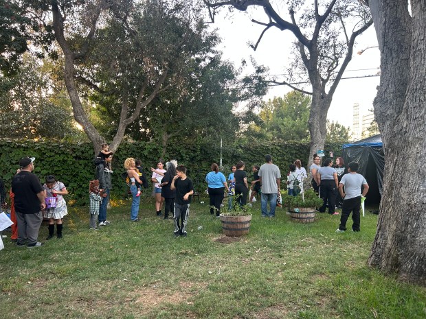 Kids and their families waited in line to enter CityHeART’s...