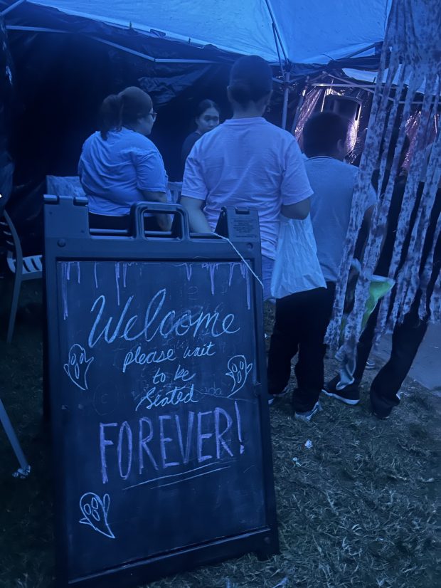 As guests waited to go through CityHeART’s haunted house, they...