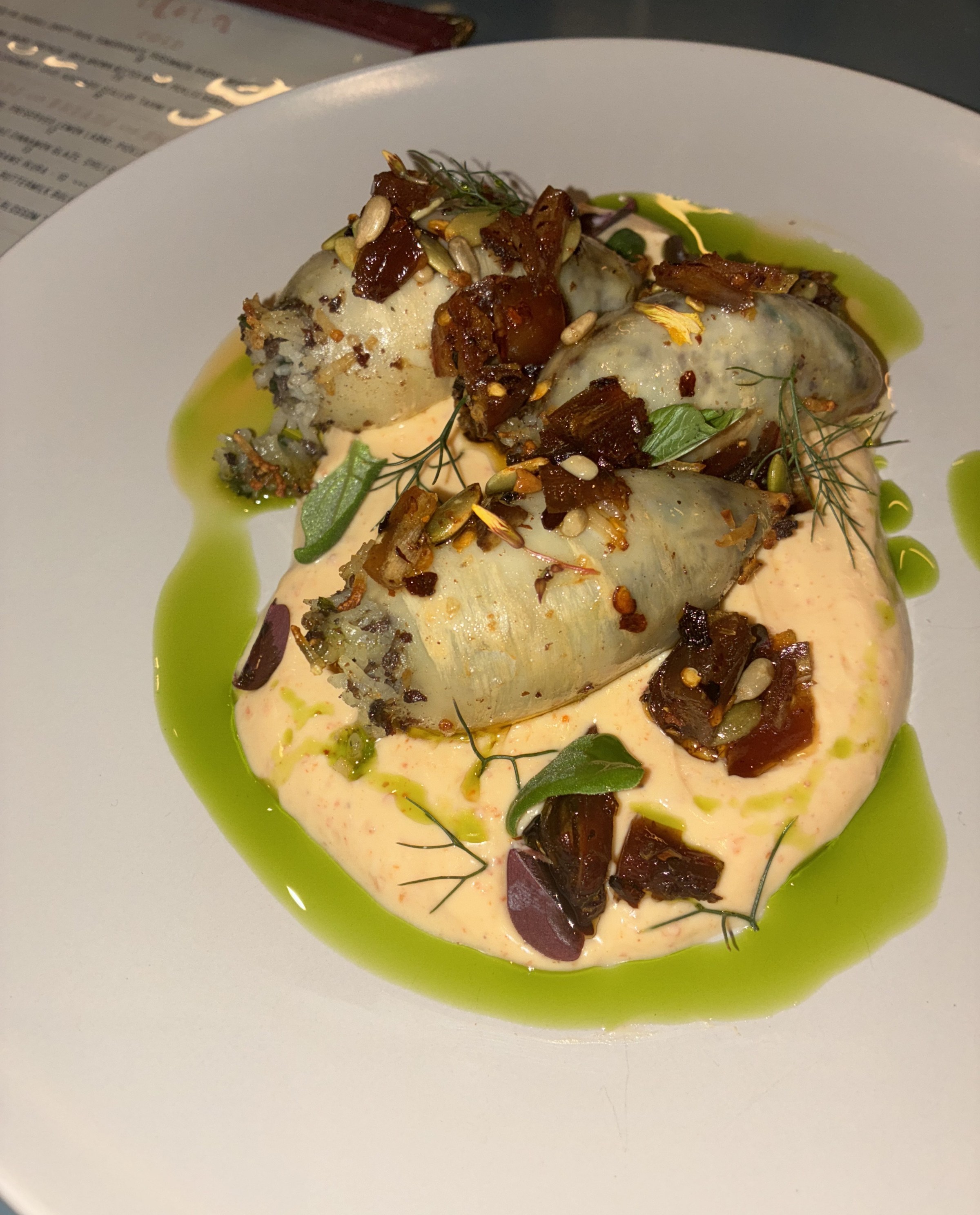 Stuffed squid on a plate.