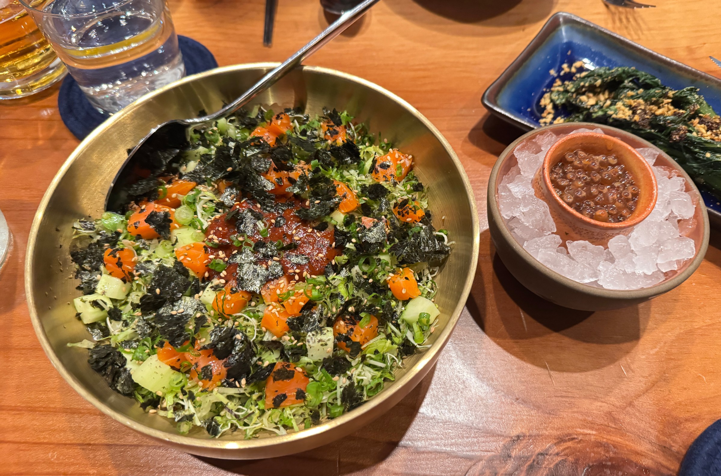 A dish with vegetables, rice and seaweed, with roe on the side, from Oken in Oakland.