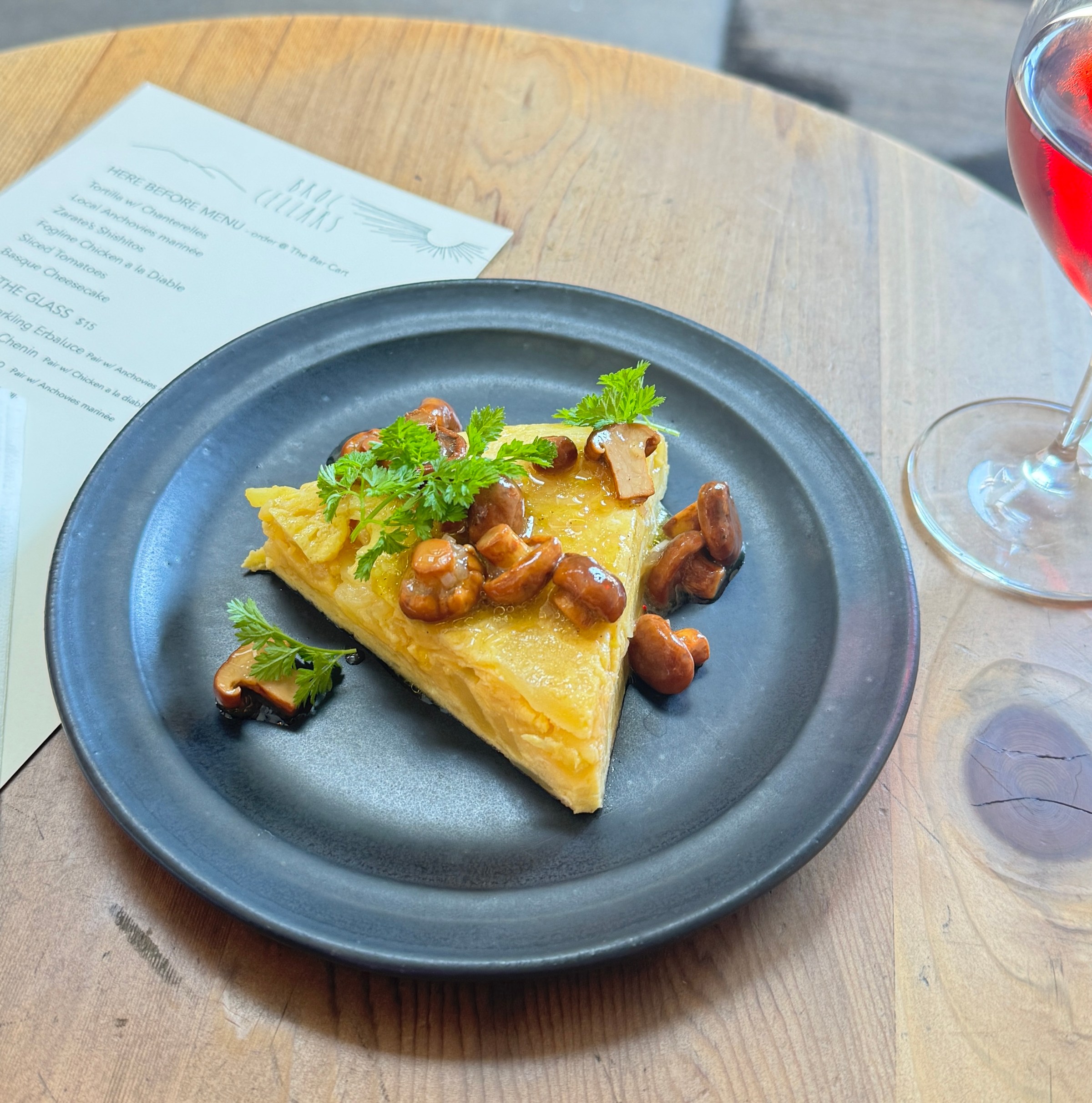 A Spanish tortilla with mushrooms on top from pop-up Here Before.
