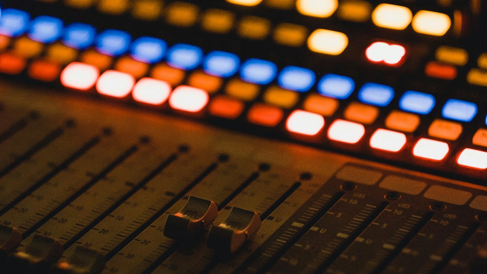 DESCRIBE THE IMAGE FOR ACCESSIBILITY, EXAMPLE: Photo of a lit up operation board with dials.