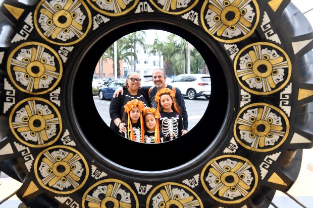The Brown-Najera Family poses for a picture as the Museum...