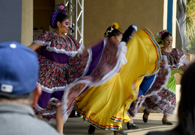 The Ballet Folklórico Almitas Mexicanas performs during the Día de...