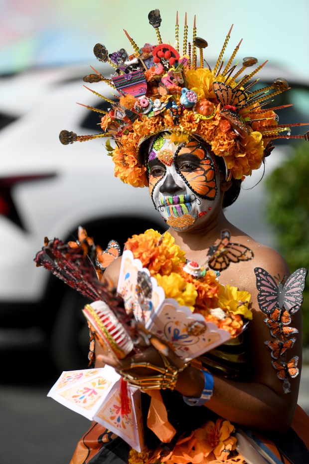 Monique Cominy attends the Día de los Muertos festival at...
