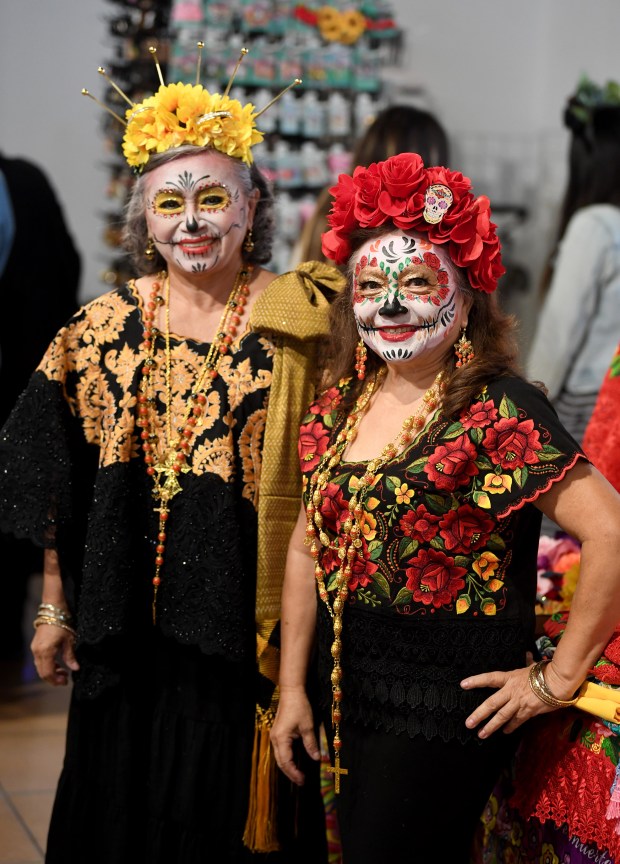 Mirna Aracelly-Zapata, left, and Sara Zapata Mijares pose for pictures...