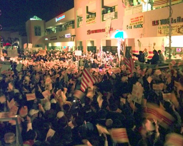 About five hundred Vietnamese-American protesters congregate outside the HiTek video store in 1999 amid days of protests. Demonstrators were protesting store owner Truong Van Tran, who outraged the Vietnamese community by hanging a communist flag and a photo of Ho Chi Minh in his storefront. (AP Photo/Nick Ut)