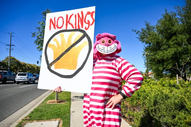 Protesters gather near Ontario Ave in Corona on Saturday, Oct....