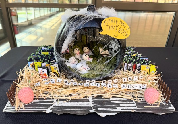 A spooky reading scene featuring a graveyard of banned book...