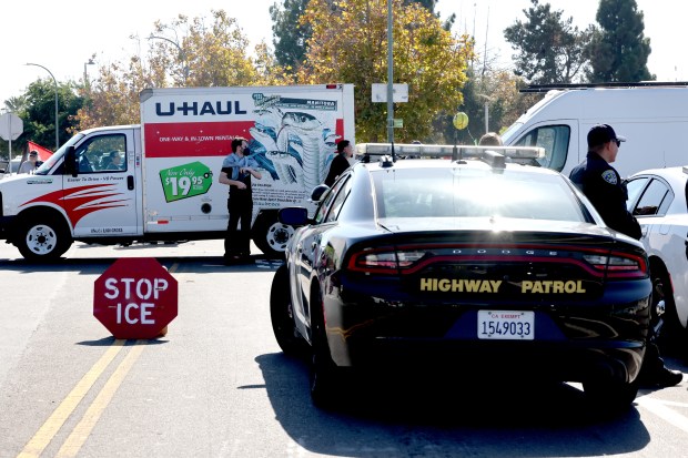A U-Haul truck and several other vehicles block the entrance to U.S. Coast Guard Island in Oakland, Calif., during an anti-immigration protest on Thursday, Oct. 23, 2025. Later that night, Coast Guard security officers opened fire on the U-Haul truck after it failed to stop and began reversing up the entrance ramp. (Ray Chavez/Bay Area News Group)