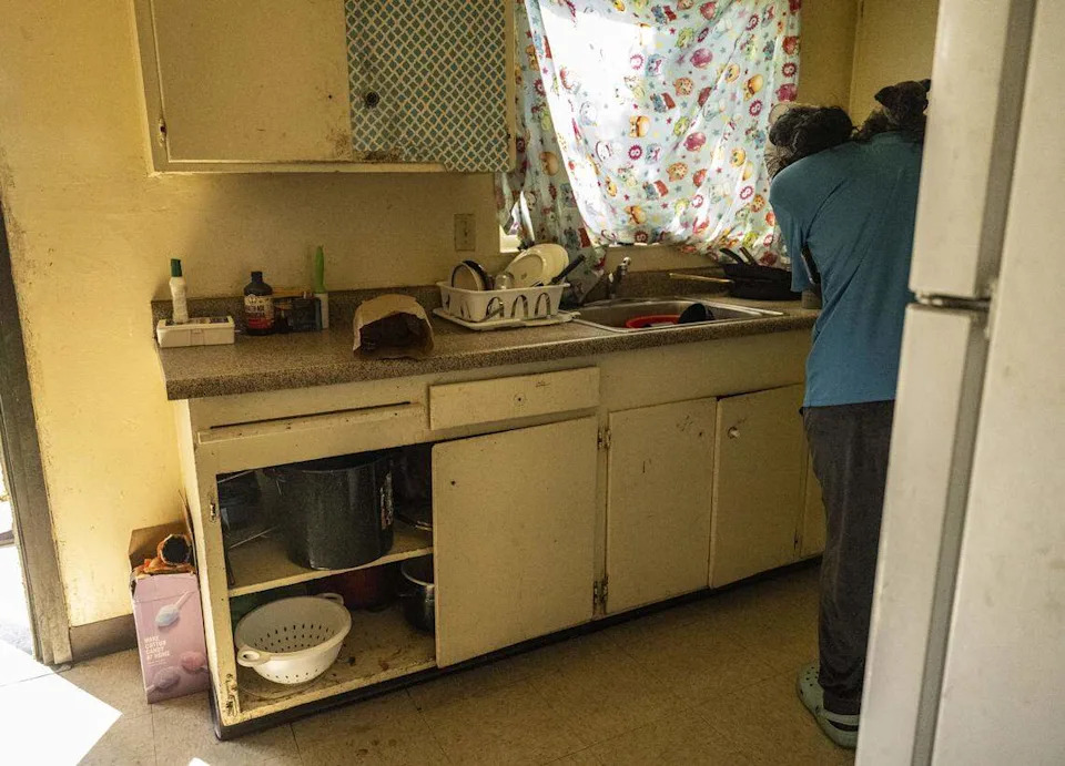 Broken kitchen cabinet doors are among the repairs that Angel Thomas, a resident at the Alder Grove complex off Broadway, said need attention on Thursday. A recent report by SHRA estimates renovations to Marina Vista and Alder Grove could exceed $1 billion.