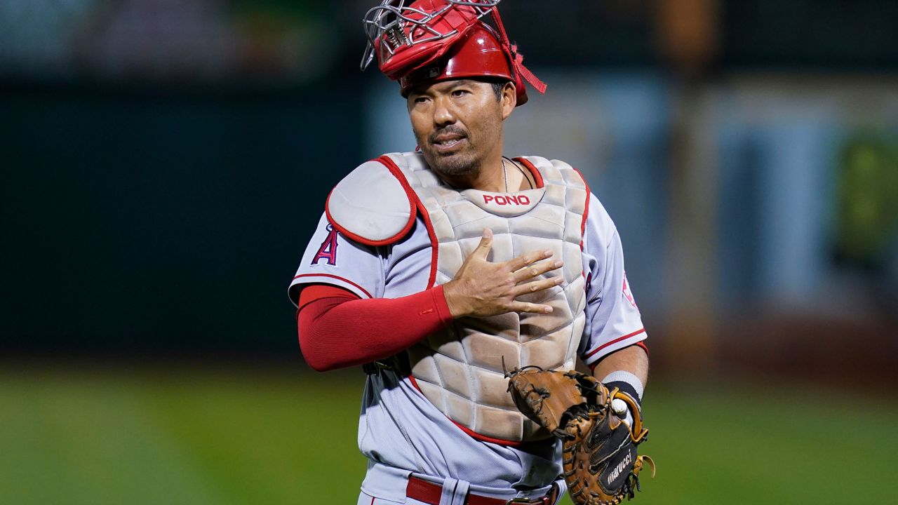 Then-Los Angeles Angels catcher Kurt Suzuki gestures during the first inning of a baseball game against the Oakland Athletics in Oakland, Calif., Oct. 4, 2022. (AP Photo/Godofredo A. Vásquez)
