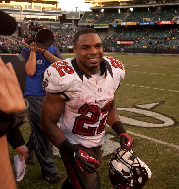 Tampa Bay Buccaneers running back Doug Martin (22) walks off the field after a staggeringly successful day against the Oakland Raiders in an NFL football game, Sunday, Nov. 4, 2012 at O.co Coliseum in Oakland, Calif. Martin rushed for 251 yards and four touchdowns, as the Buccaneers won, 42-32. (D. Ross Cameron/Staff)