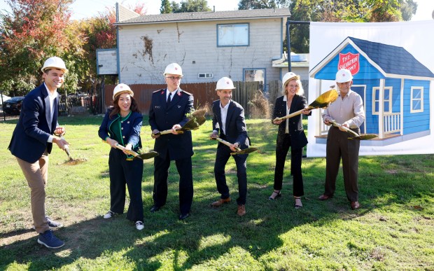 Officials pose for a photograph during The Salvation Army Silicon Valley groundbreaking ceremony for their HOPE Community Safe and Sober Overnight and Transitional Housing program in San Jose, Calif., on Monday, Nov. 3, 2025. (Nhat V. Meyer/Bay Area News Group)