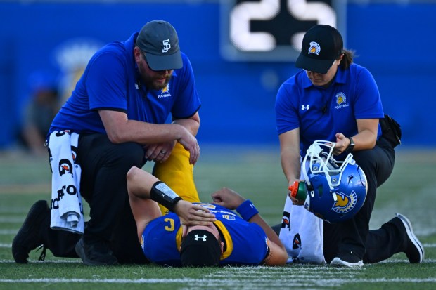 San Jose State quarterback Walker Eget (5) is attended by medical personnel after sustaining an injury while playing Air Force in the first quarter of their game at San Jose State University in San Jose, Calif., on Saturday, Nov. 8, 2025. Eget would return later to play. (Jose Carlos Fajardo/Bay Area News Group)