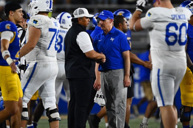 San Jose State head coach Ken Niumatalolo shakes hands with Air Force head coach Troy Calhoun after their game at San Jose State University in San Jose, Calif., on Saturday, Nov. 8, 2025. Air Force defeated San Jose State 26-16. (Jose Carlos Fajardo/Bay Area News Group)