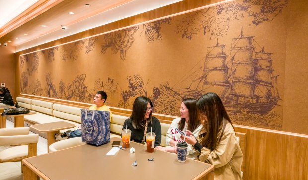 Customers enjoy their drinks inside Chagee Modern Teahouse at the...