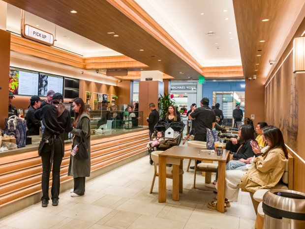 Customers pick up orders and enjoy drinks inside Chagee Modern...