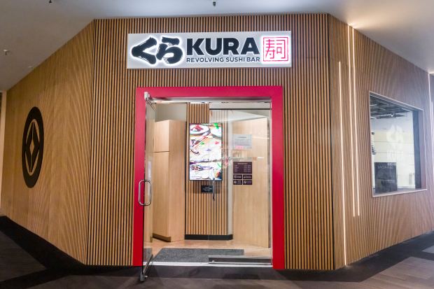 The entrance at Kura Revolving Sushi Bar at the Brea...