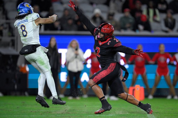SAN DIEGO, CALIFORNIA - NOVEMBER 22: Trey White #2 of the San Diego State Aztecs pressures Tama Amisone #8 of the San Jose State Spartans during the second half at Snapdragon Stadium on November 22, 2025 in San Diego, California. (Photo by Orlando Ramirez/Getty Images)
