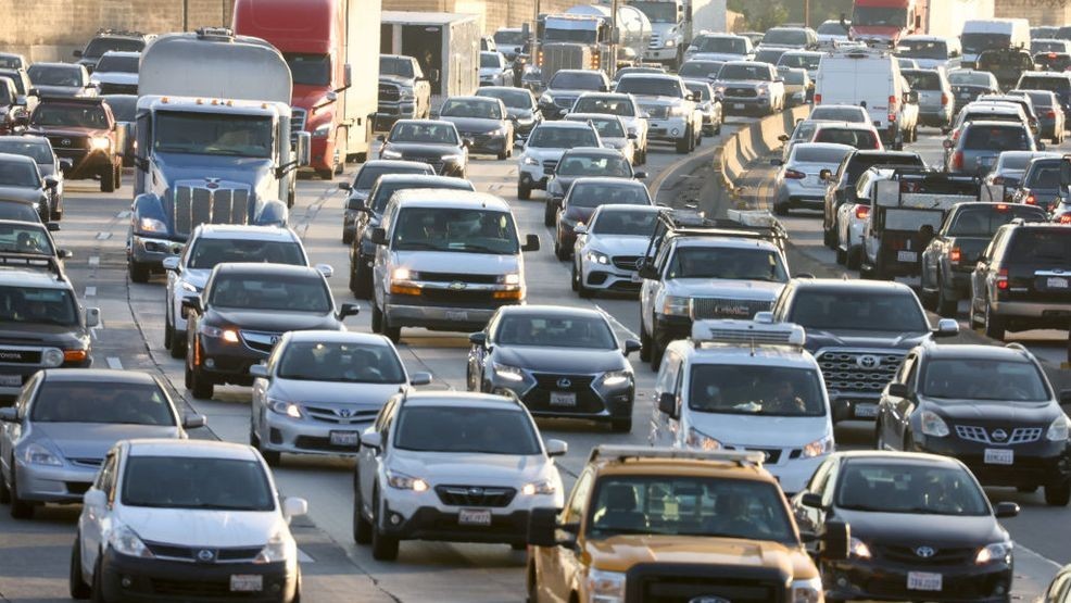 LOS ANGELES, CALIFORNIA - NOVEMBER 23: Heavy afternoon traffic moves along the I-5 on November 23, 2022 in Los Angeles, California. The American Automobile Association (AAA) predicts nearly 55 million Americans will travel 50 miles or more for the Thanksgiving holiday weekend, 98 percent of pre-pandemic volumes. AAA also projects that nearly 49 million are expected to travel by vehicle this week, while around 4.5 million will fly to their Thanksgiving destinations. (Photo by Mario Tama/Getty Images)