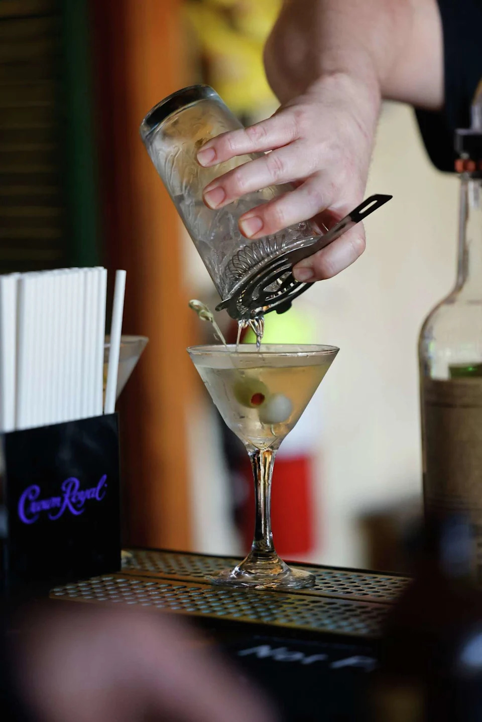 Chris McKenna, bar manager, prepares martinis as he serves customers at The Pig and Whistle. (Lea Suzuki/S.F. Chronicle)