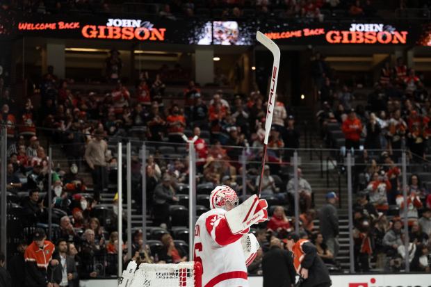 Detroit Red Wings goaltender and former Ducks netminder John Gibson gestures to fans during the opening period Friday, Oct. 31, 2025, in his first return to Honda Center since being traded in the offseason. (AP Photo/Kyusung Gong)