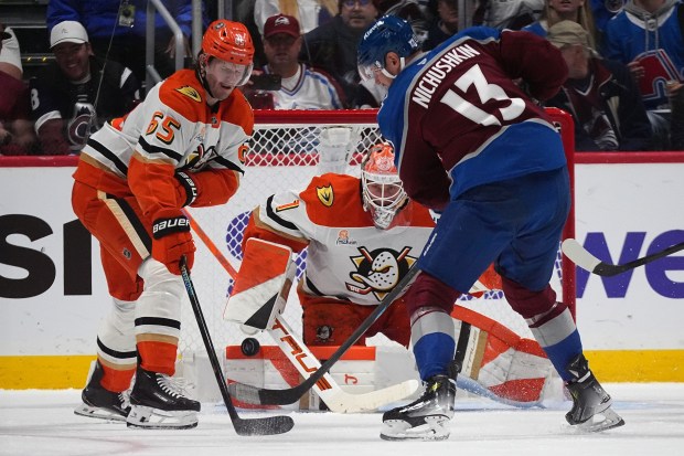 Colorado Avalanche right wing Valeri Nichushkin, front right, puts a...