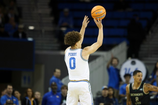 UCLA guard Trent Perry (0) takes a 3-point shot as...