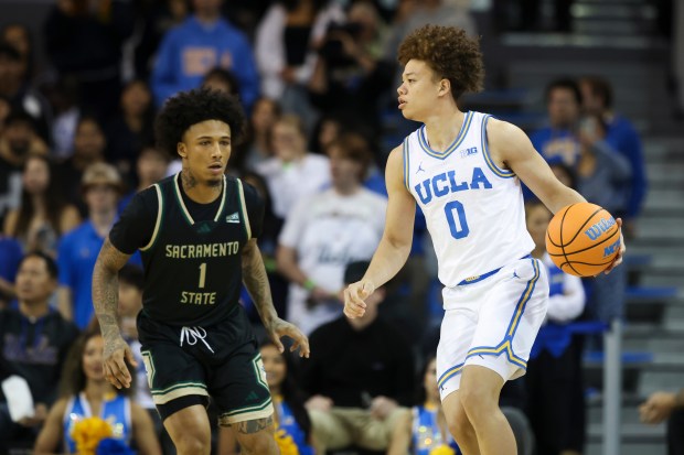 UCLA guard Trent Perry (0) dribbles against Sacramento State guard...