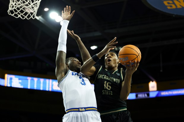 Sacramento State guard Prophet Johnson (16) drives against UCLA forward...